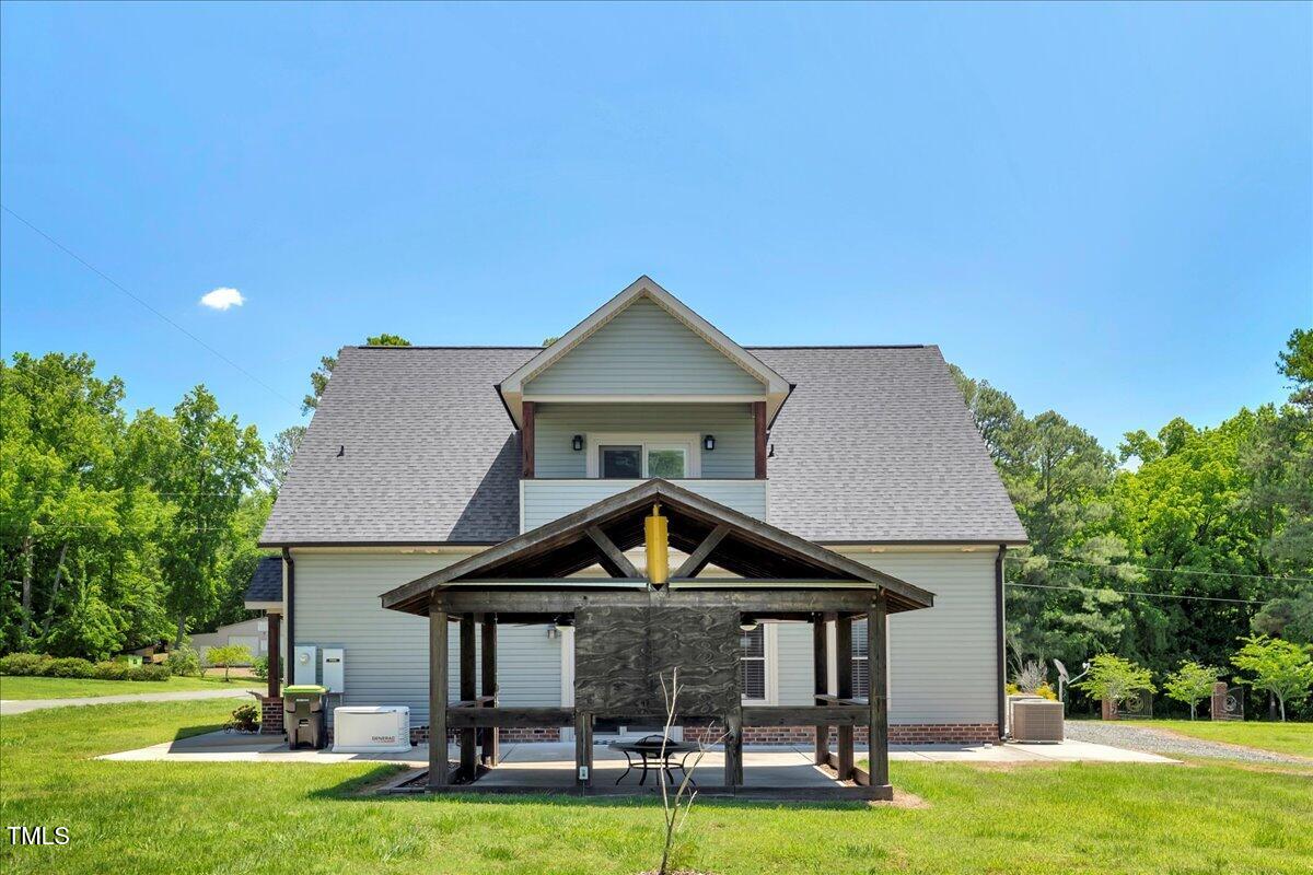 2258 Sanders Road Stem, NC 27581 - Photo 35 of 42 a front view of a house with garden