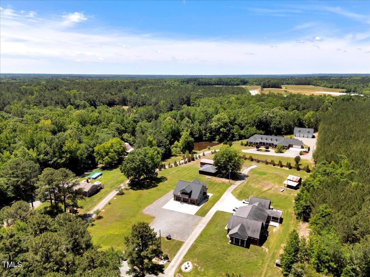 2258 Sanders Road Stem, NC 27581 - Photo 39 of 42 an aerial view of residential houses with outdoor space