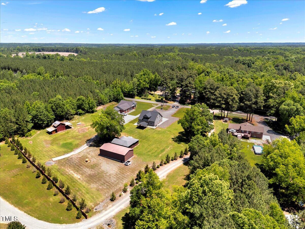 2258 Sanders Road Stem, NC 27581 - Photo 41 of 42 a view of a swimming pool with a yard