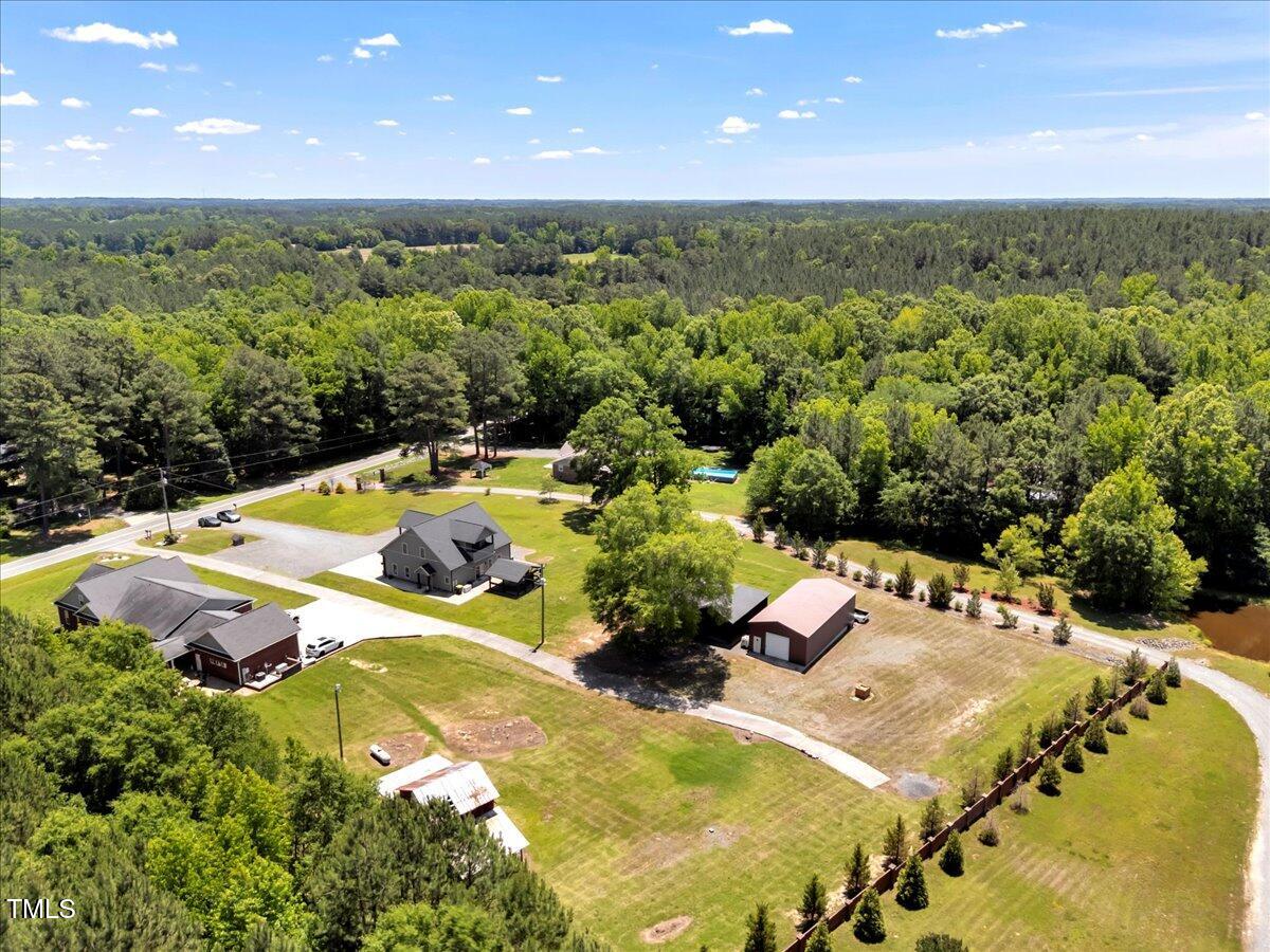 2258 Sanders Road Stem, NC 27581 - Photo 42 of 42 a view of a swimming pool and lounge chair