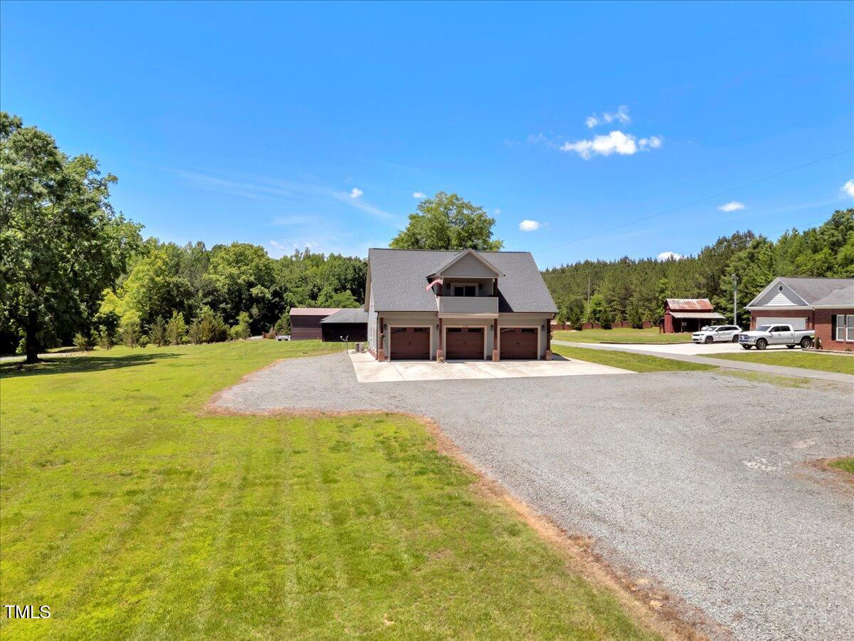 2258 Sanders Road Stem, NC 27581 - Photo 5 of 42 a house view with a swimming pool