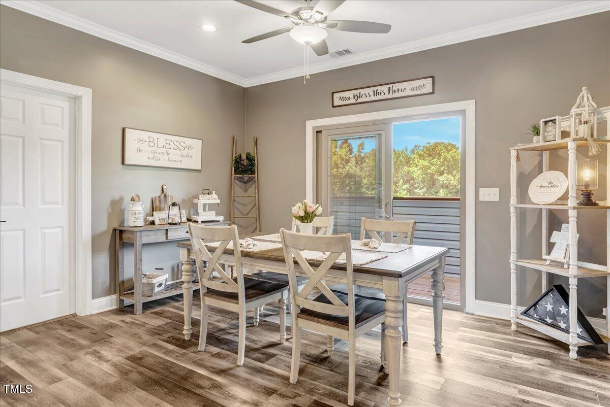 2258 Sanders Road Stem, NC 27581 - Photo 6 of 42 a view of a dining room with furniture window and outside view