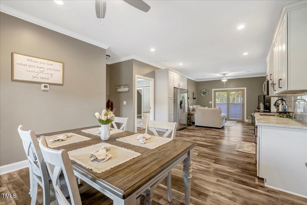 2258 Sanders Road Stem, NC 27581 - Photo 7 of 42 a view of a dining room kitchen and a wooden floor