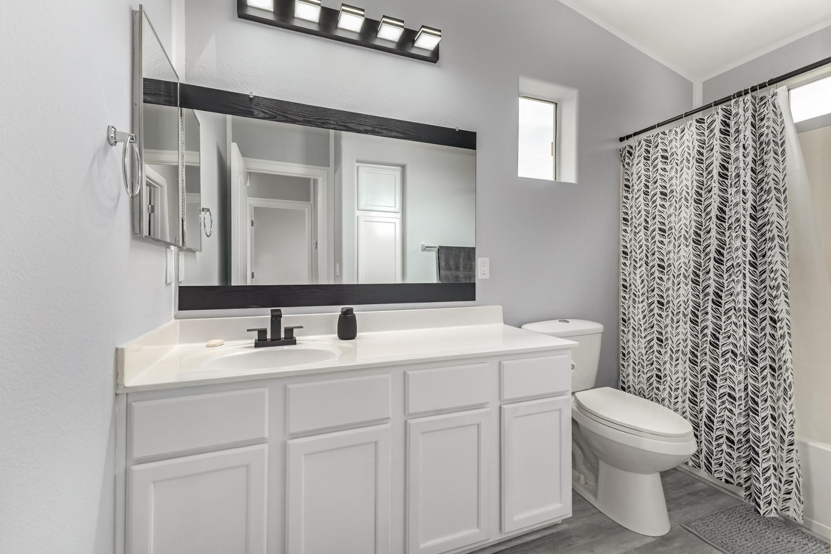 1350 South Greenfield Road, Unit 2205 Mesa, AZ 85206 - Photo 26 of 42 a bathroom with a toilet sink and mirror