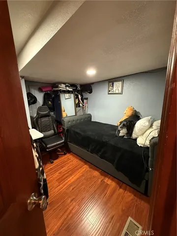 a bed room with bed and window