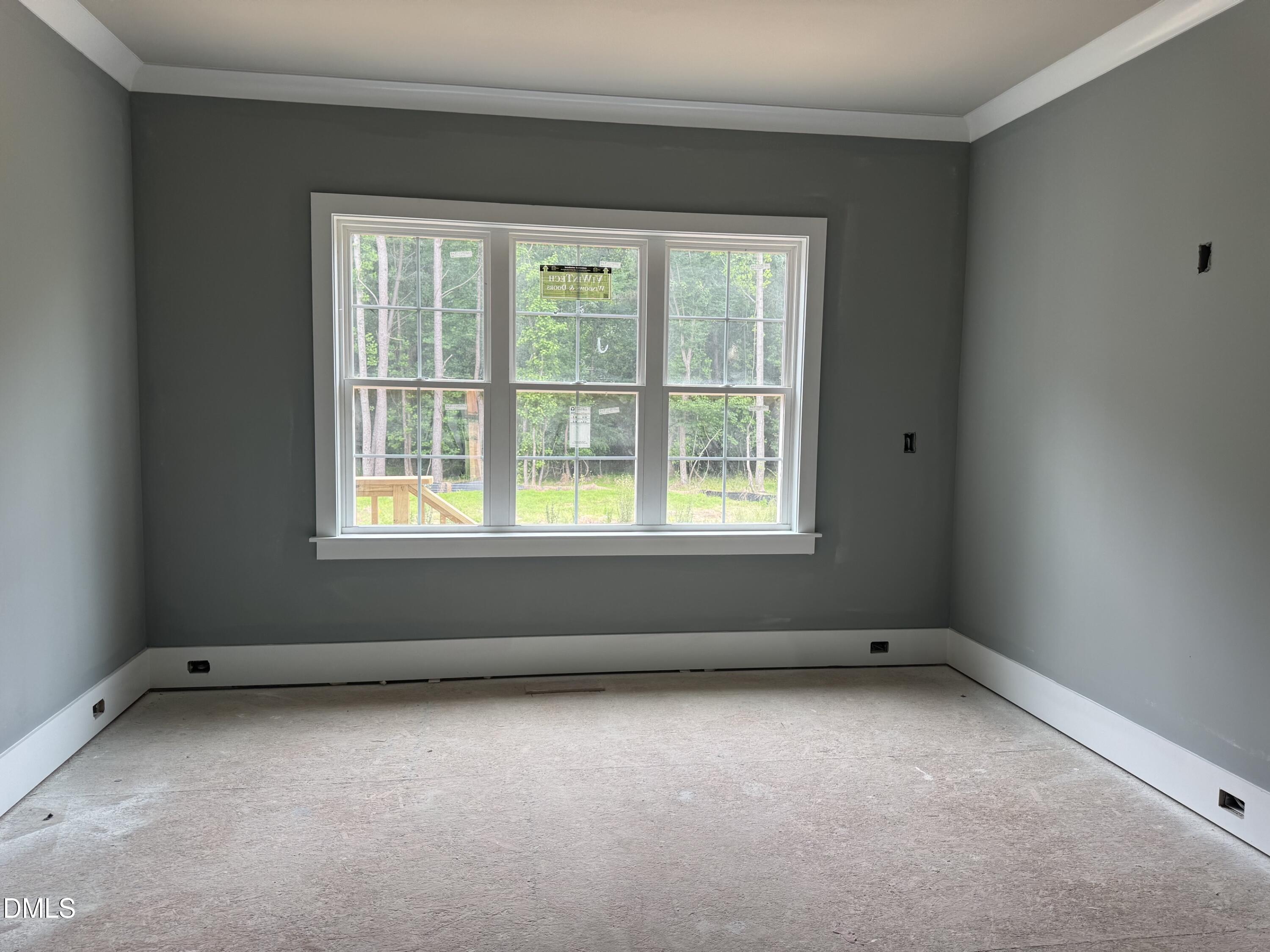 935 Lynch Road Selma, NC 27576 - Photo 10 of 21 an empty room with a window