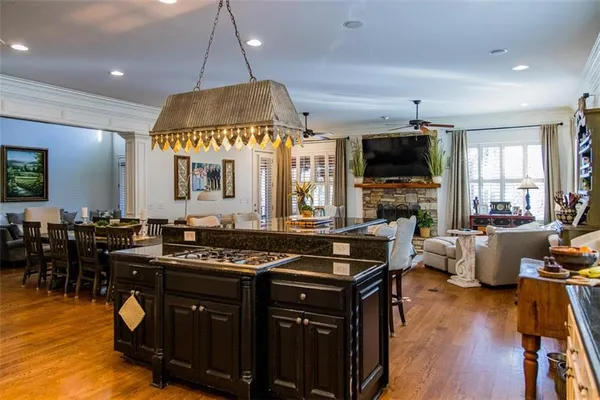 a kitchen with furniture and a flat screen tv