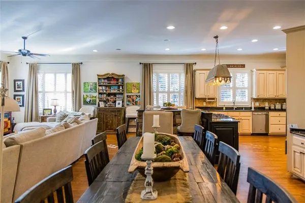 a kitchen with stainless steel appliances granite countertop a refrigerator and a stove