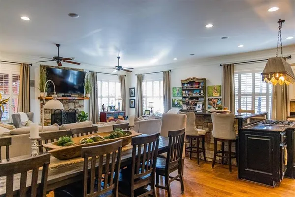 a living room with furniture a clock and a fireplace