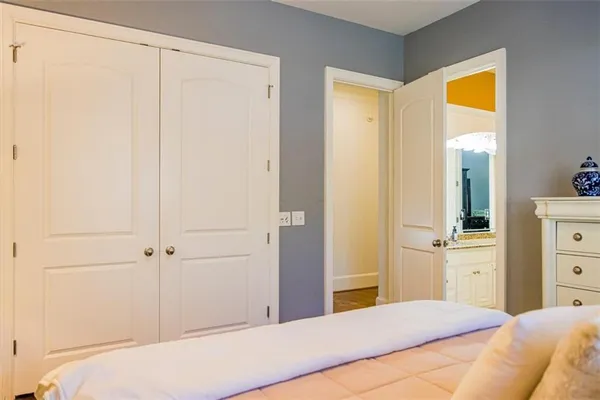 a bedroom with a bed and a television