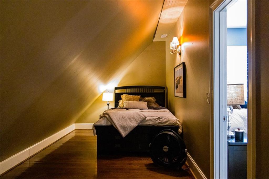 280 Ravenwood Drive Southeast Rome, GA 30161 - Photo 53 of 56 a bedroom with a bed and wooden floor