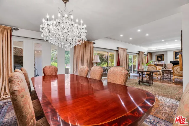a view of a house with a yard and potted plants
