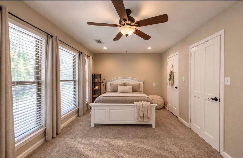384 Ft Graham Road Waco, TX 76705 - Photo 16 of 36 Dual windows with blinds, recessed lighting, ceiling fan with light fixture, and two panel interior doors