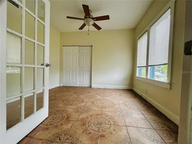 a view of an empty room with a window