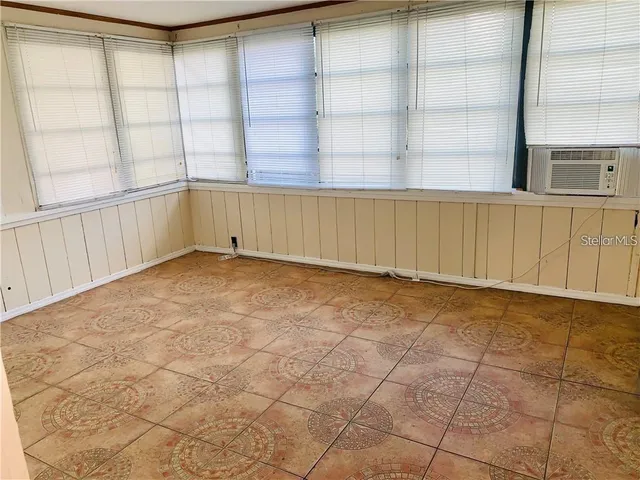 a bathroom with a toilet and a bathtub