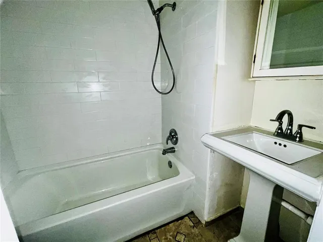 a bathroom with a sink and a bathtub