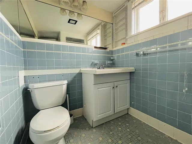 a bathroom with a shower and a sink
