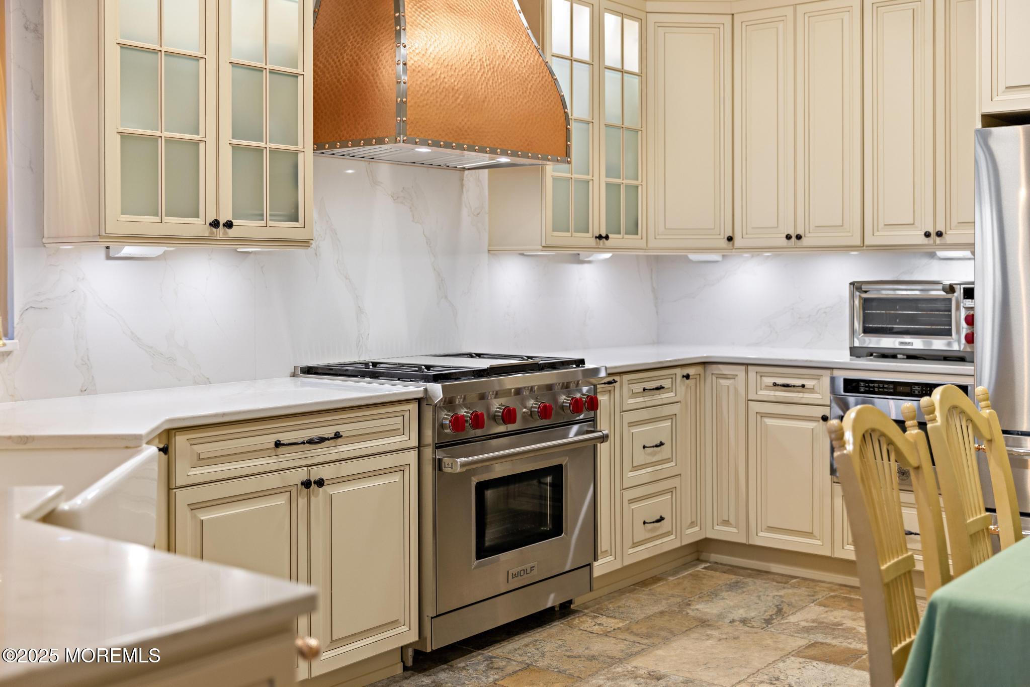 1501 Ocean Avenue, Unit 2112 Asbury Park, NJ 07712 - Photo 15 of 43 a kitchen with stainless steel appliances granite countertop a stove and a sink