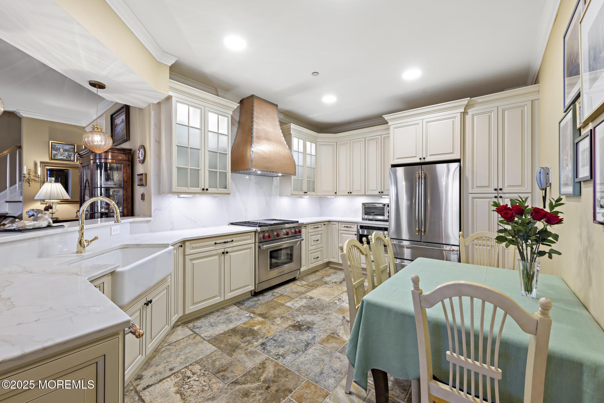 1501 Ocean Avenue, Unit 2112 Asbury Park, NJ 07712 - Photo 18 of 43 a kitchen with refrigerator and cabinets