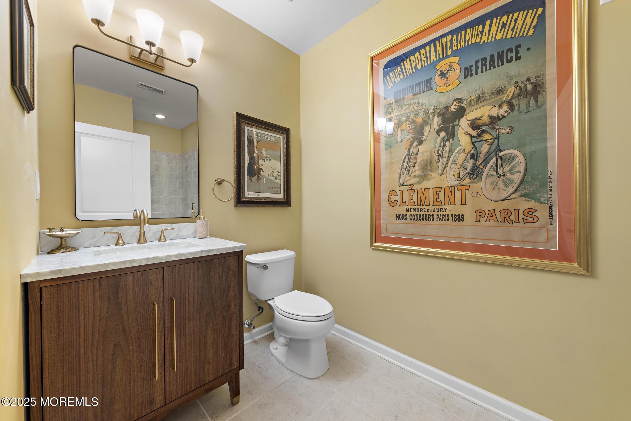 1501 Ocean Avenue, Unit 2112 Asbury Park, NJ 07712 - Photo 19 of 43 a bathroom with a toilet sink and mirror