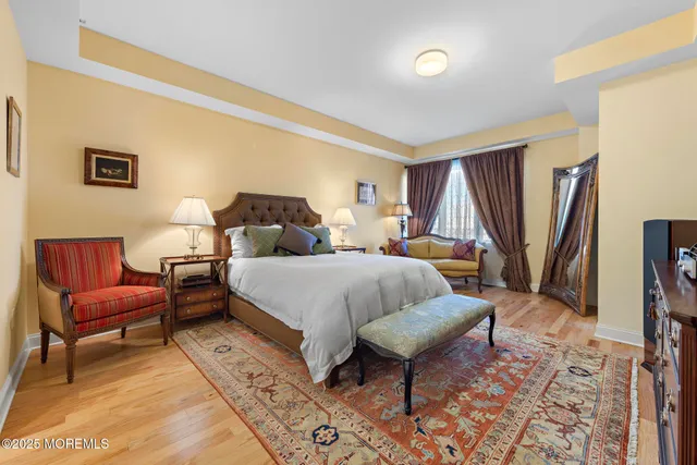 a spacious bedroom with a bed and a couch