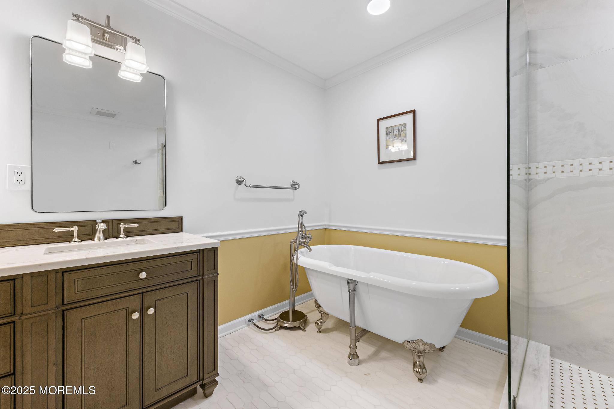 1501 Ocean Avenue, Unit 2112 Asbury Park, NJ 07712 - Photo 27 of 43 a bathroom with a tub sink and mirror