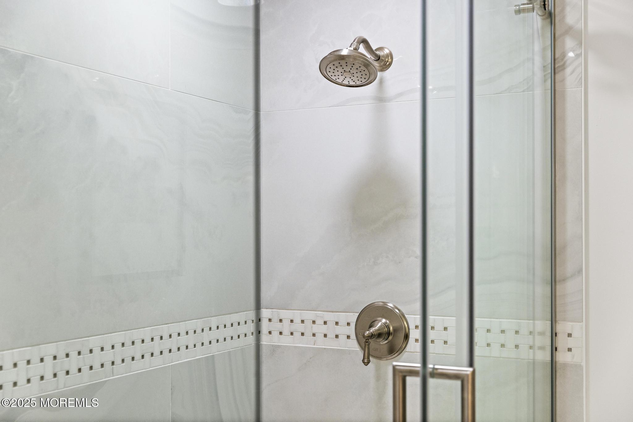 1501 Ocean Avenue, Unit 2112 Asbury Park, NJ 07712 - Photo 28 of 43 a bathroom with a shower