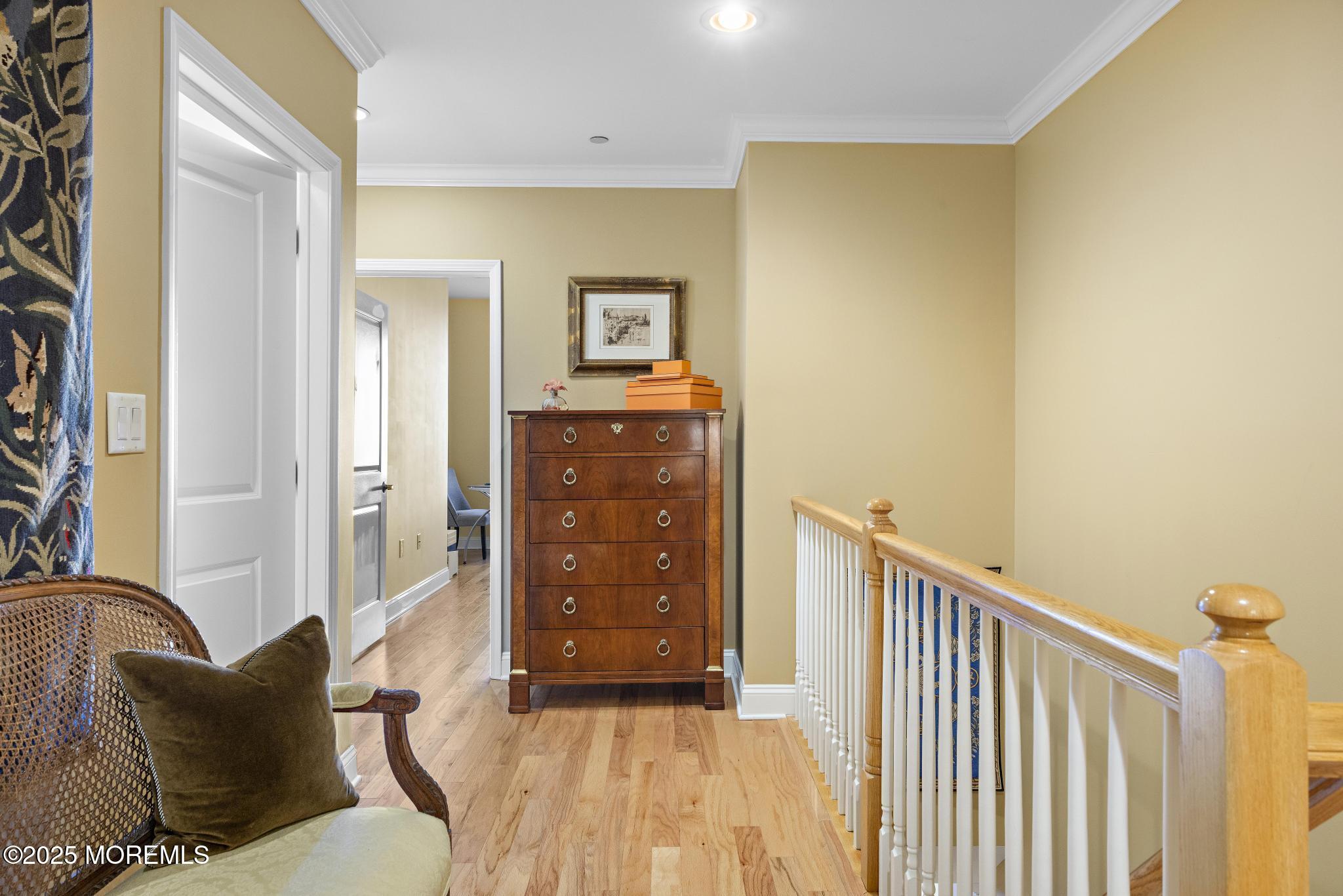 1501 Ocean Avenue, Unit 2112 Asbury Park, NJ 07712 - Photo 30 of 43 a bedroom with a bed and wooden floor