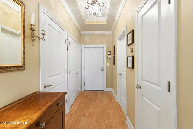 a view of a hallway with a chandelier