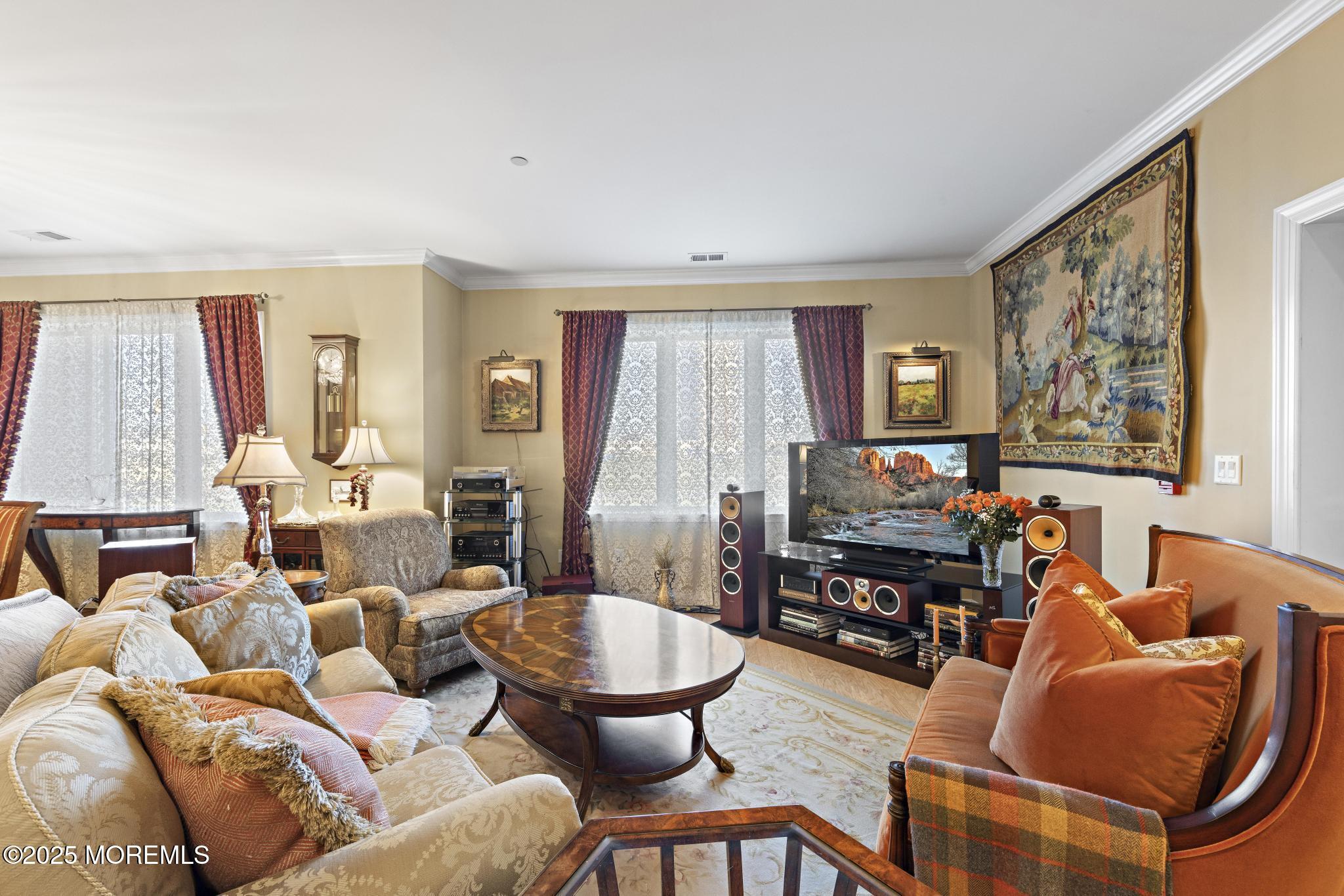 1501 Ocean Avenue, Unit 2112 Asbury Park, NJ 07712 - Photo 8 of 43 a living room with furniture and a flat screen tv