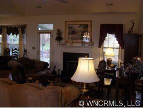 15 Livingston Farm Road Fletcher, NC 28732 - Photo 3 of 10 a living room with furniture and a fireplace