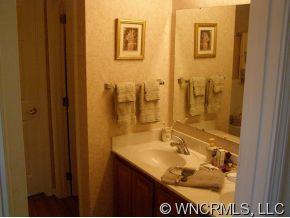 15 Livingston Farm Road Fletcher, NC 28732 - Photo 7 of 10 a bathroom with a sink and a mirror