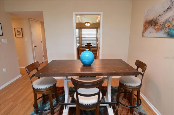 a view of a chair and table in the balcony