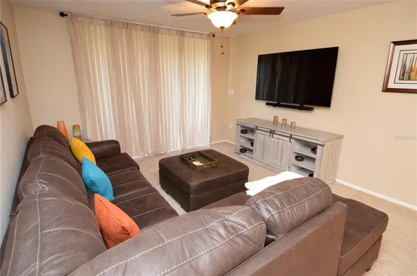 a view of a city from a balcony with furniture