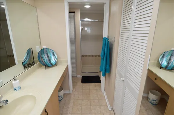 a swimming pool with outdoor seating and a garden