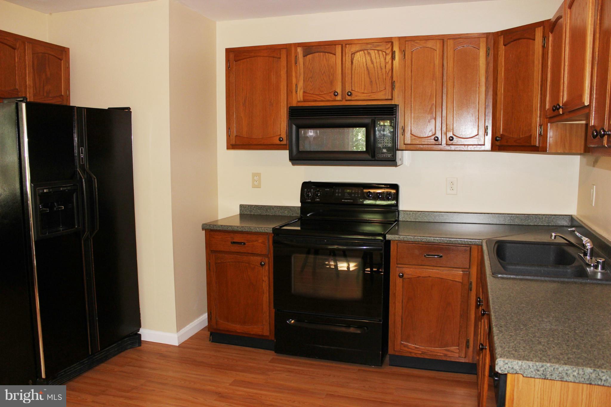 376 Highview Road Harpers Ferry, WV 25425 - Photo 10 of 22 Kitchen with Black Appliances