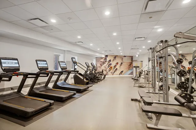 a view of a terrace with lawn chairs
