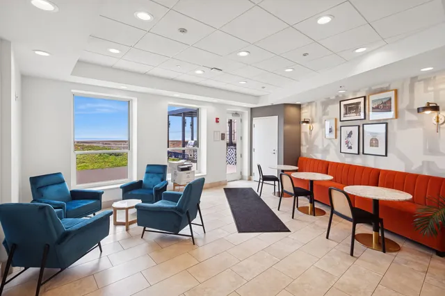 a view of a patio with chairs and table in patio