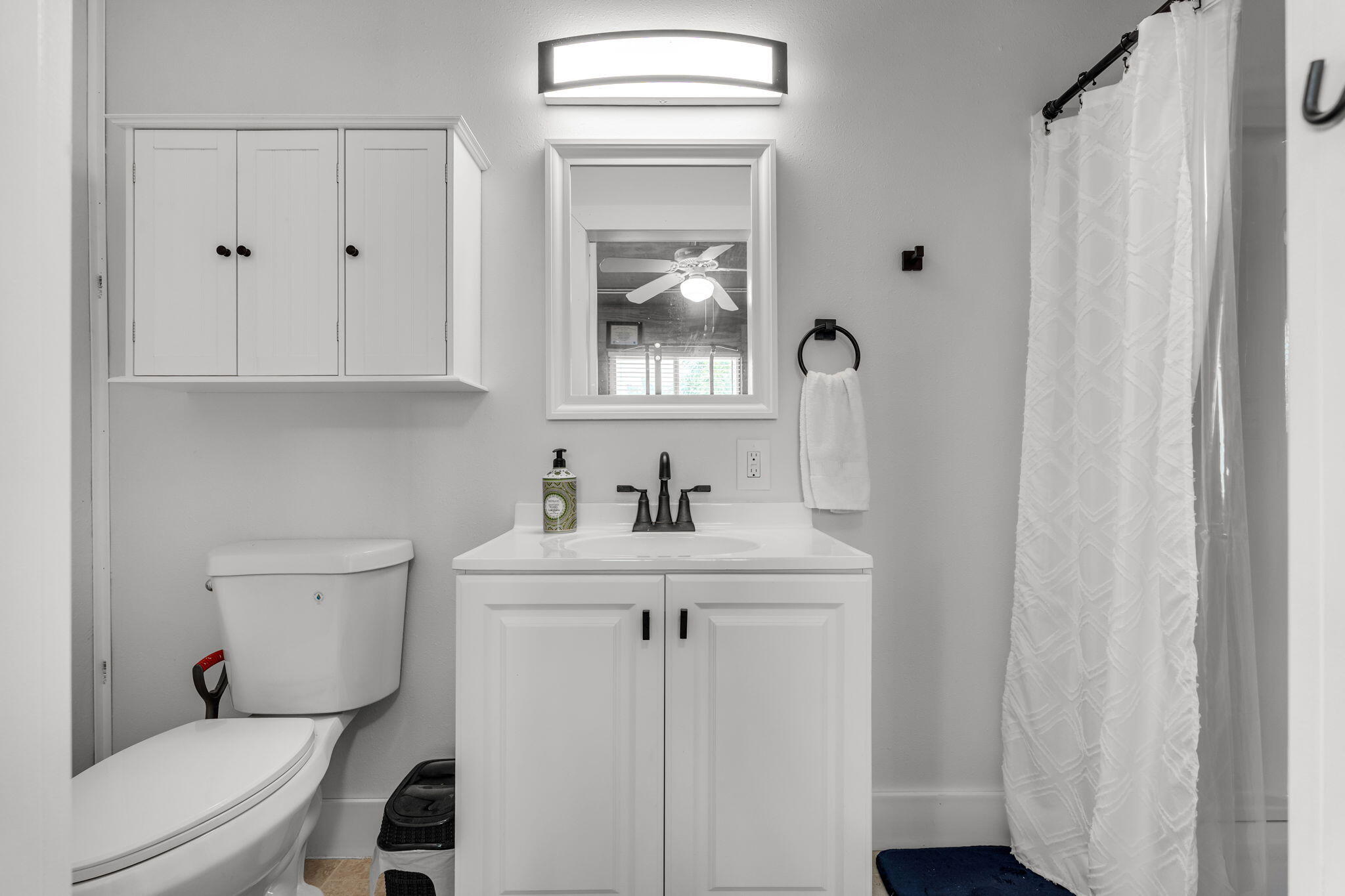 24 Mutiny Place Key Largo, FL 33037 - Photo 65 of 69 a bathroom with a toilet a sink and a window