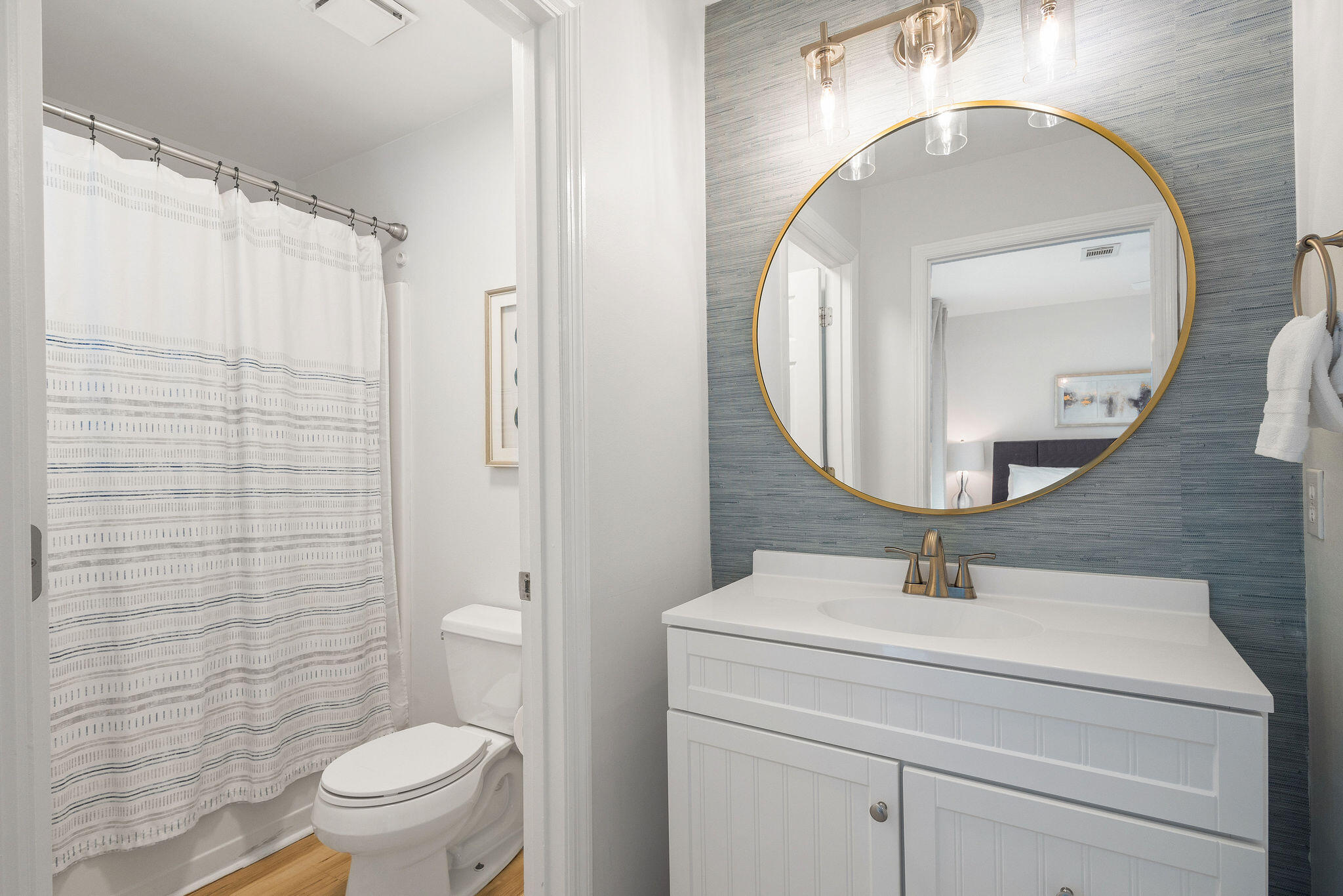 11 Beachside Drive, Unit 922 Santa Rosa Beach, FL 32459 - Photo 17 of 42 a bathroom with a toilet sink and mirror