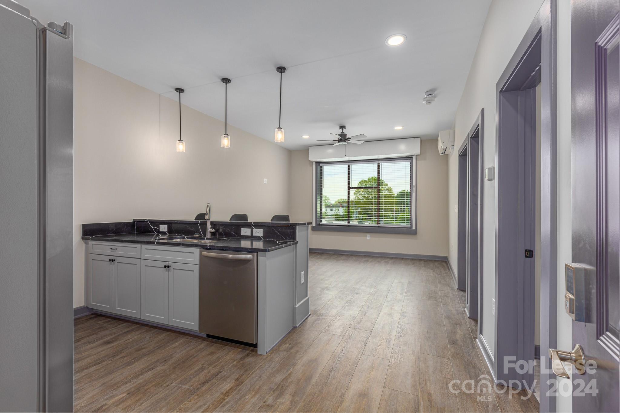 a kitchen with stainless steel appliances granite countertop a stove and a sink