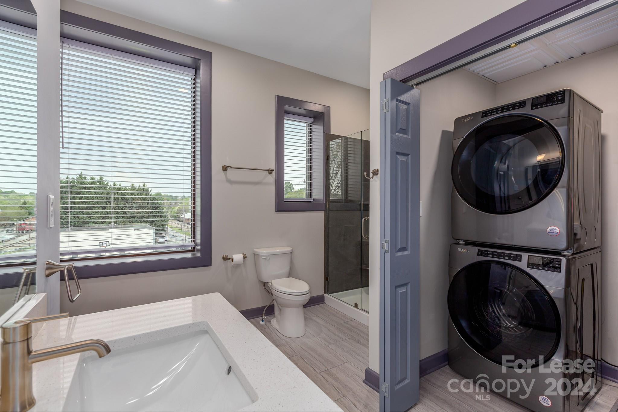 138 South Main Street, Unit D Marion, NC 28752 - Photo 6 of 11 a view of a bedroom with washer and dryer