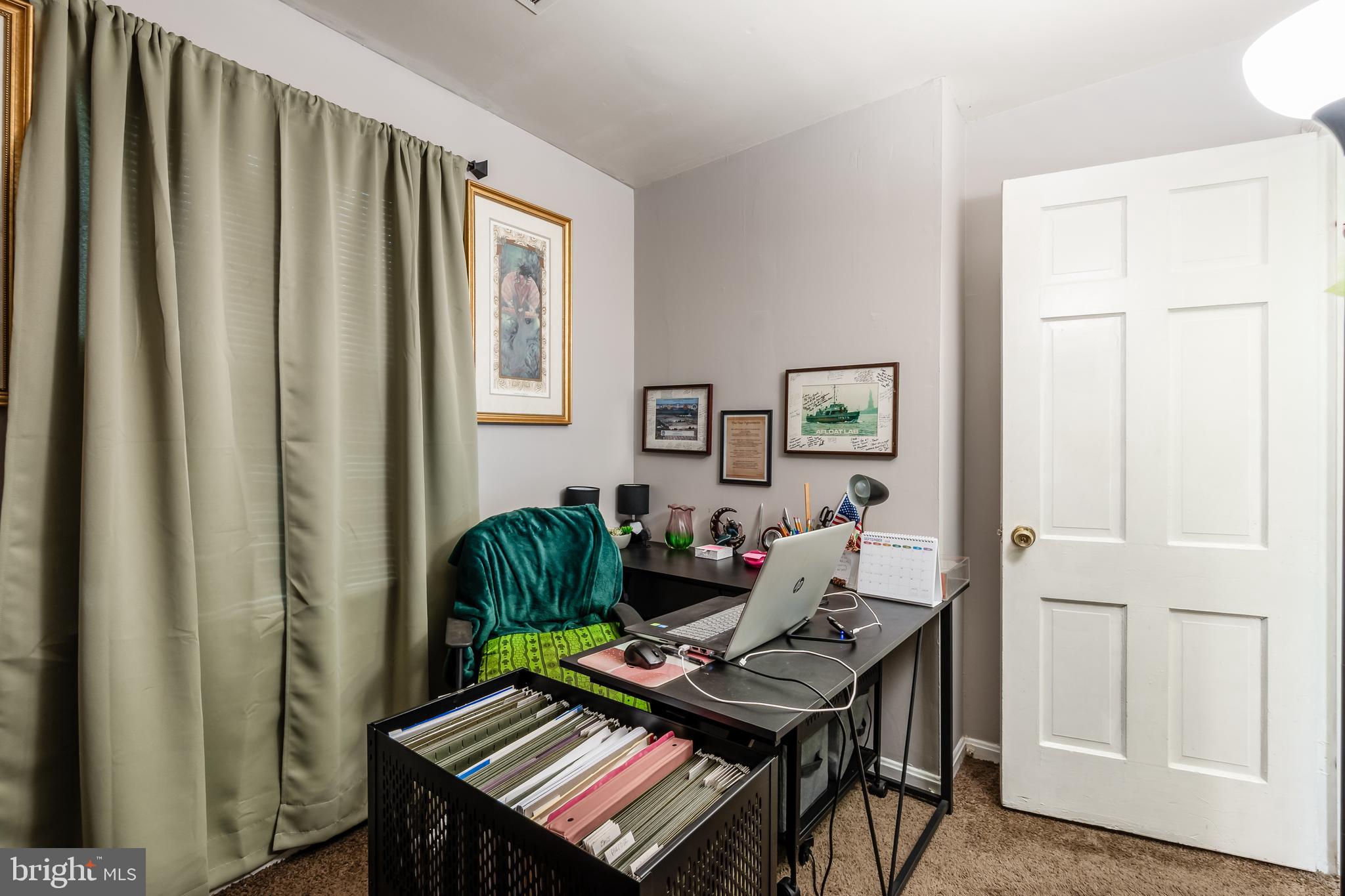 3814 V Street Southeast, Unit 101 Washington, DC 20020 - Photo 12 of 19 a living room with furniture and a window
