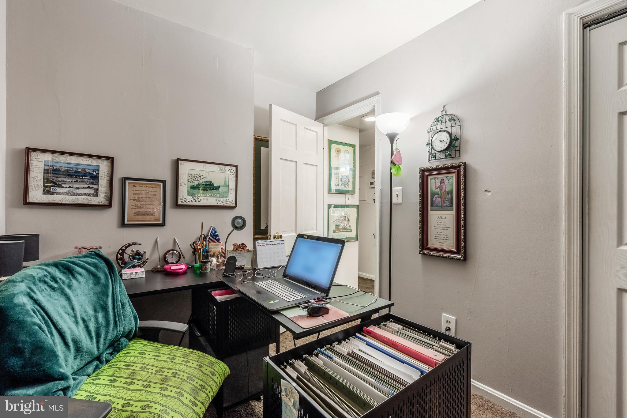 3814 V Street Southeast, Unit 101 Washington, DC 20020 - Photo 13 of 19 a living room with furniture and a window