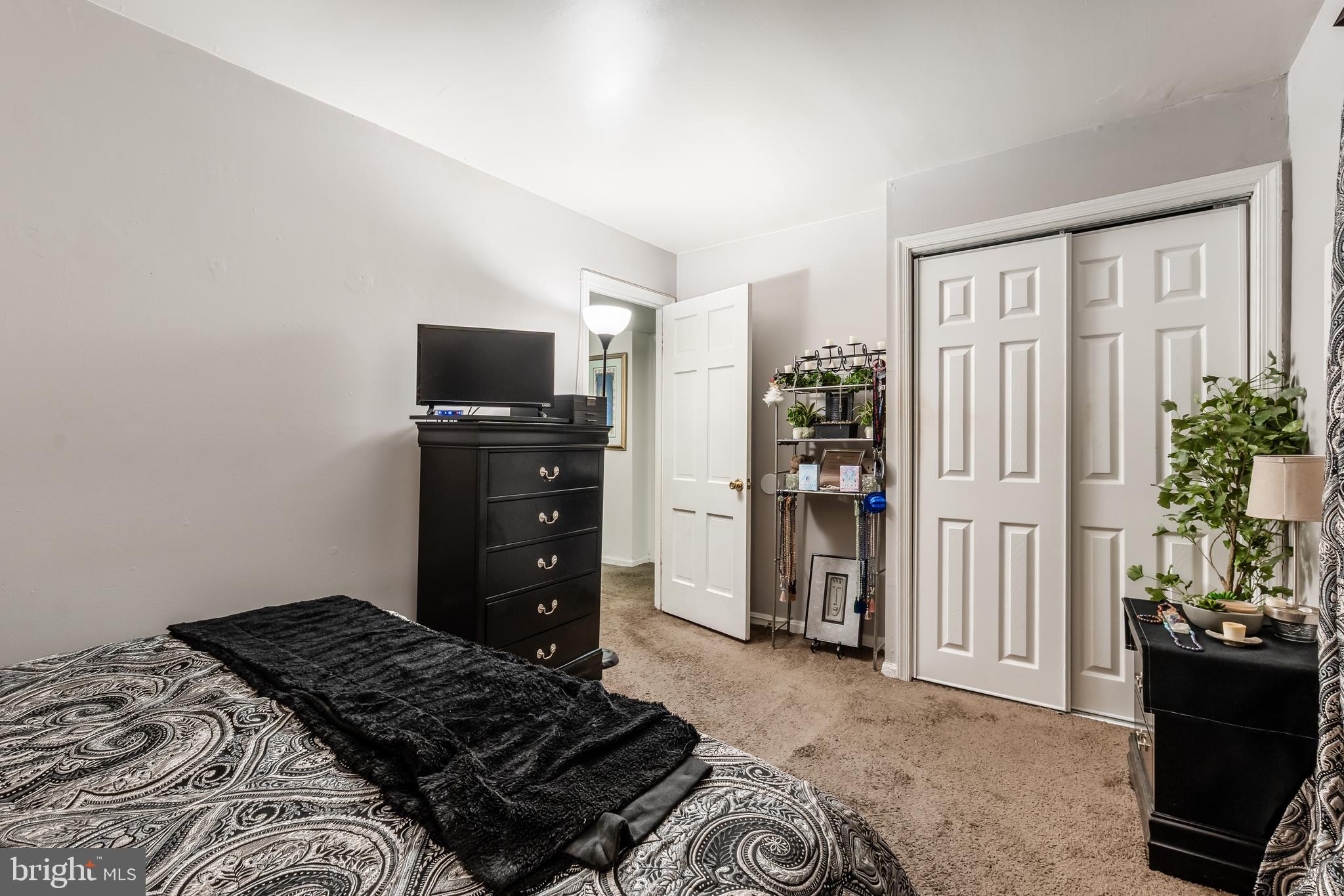 3814 V Street Southeast, Unit 101 Washington, DC 20020 - Photo 16 of 19 a bedroom with a bed and furniture