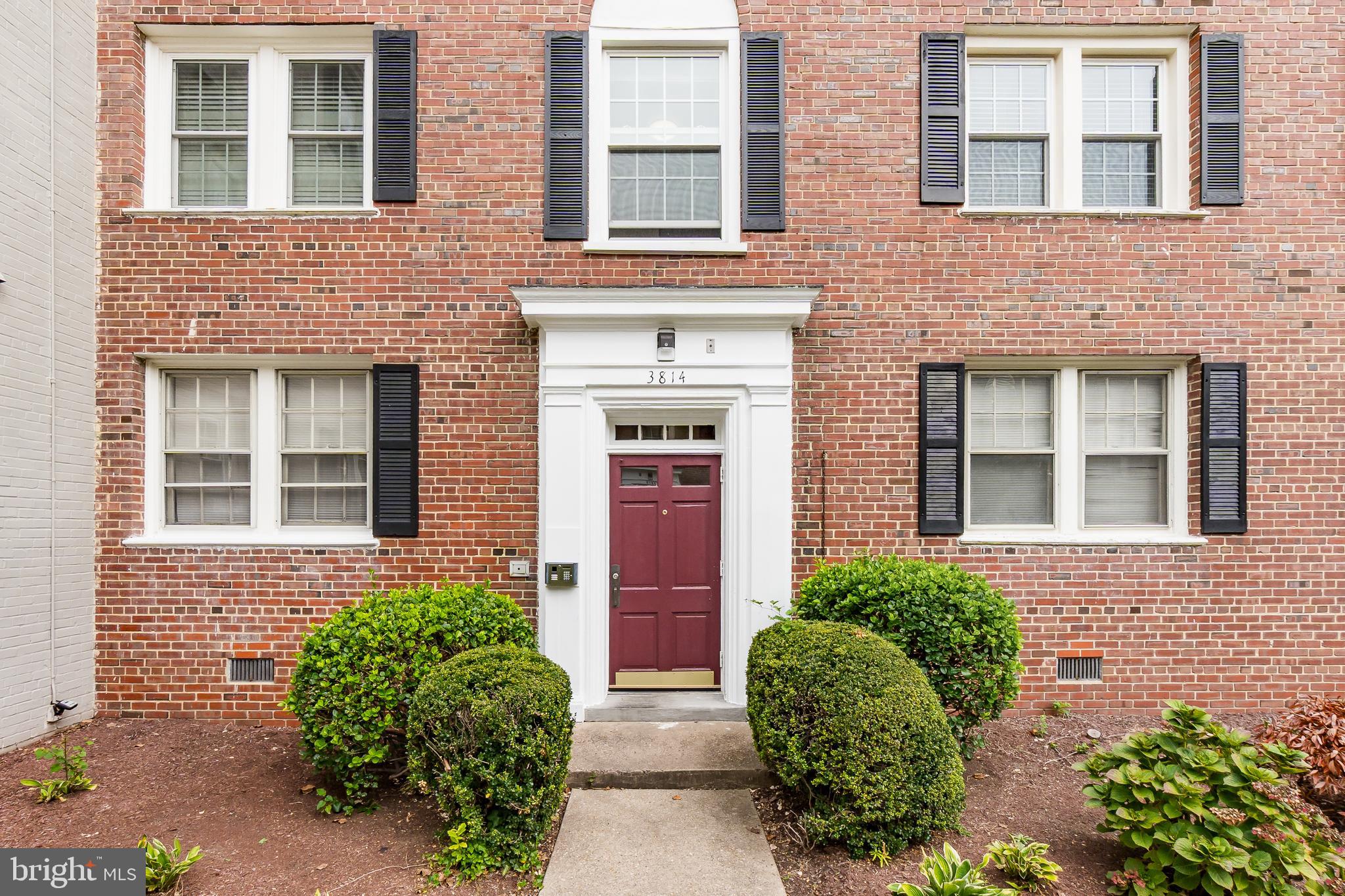 3814 V Street Southeast, Unit 101 Washington, DC 20020 - Photo 3 of 19 front view of a brick house with a large windows