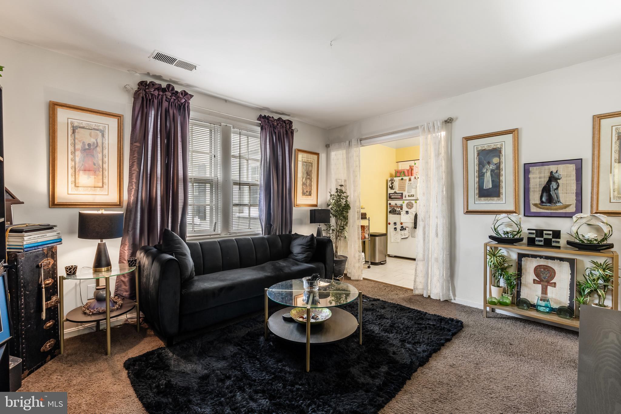 3814 V Street Southeast, Unit 101 Washington, DC 20020 - Photo 6 of 19 a living room with furniture and a fireplace