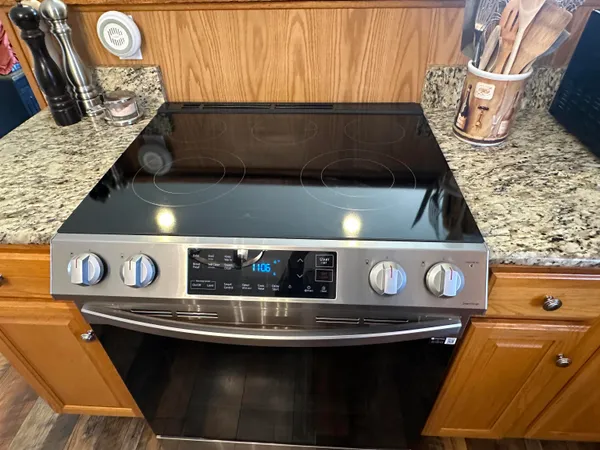 a kitchen with a table chairs and a refrigerator
