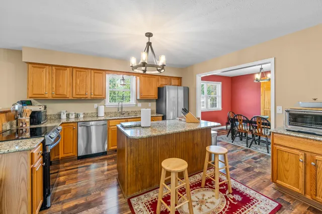 a living room with furniture a window and a fireplace