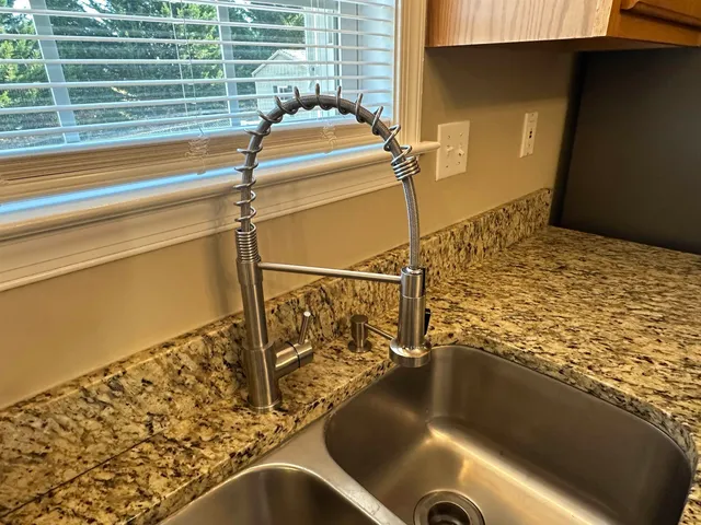 a dining room with furniture window and wooden floor